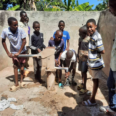 Children by newly repaired well
