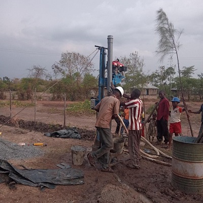 Drilling team making a new well at Ori Bwanda community
