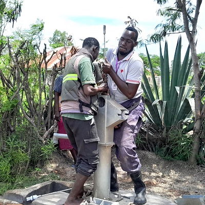 Kasaye hand-pump under repair