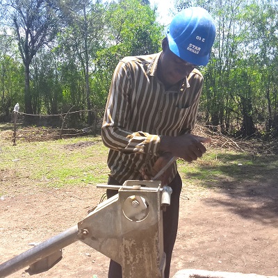Kongidi community handpump under repair 