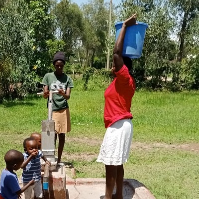 A villager taking home clean water