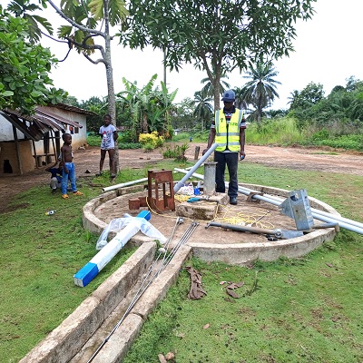Hand-pump repair team at work