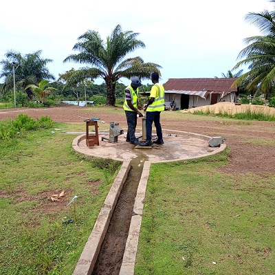 The broken hand-pump undergoing repair