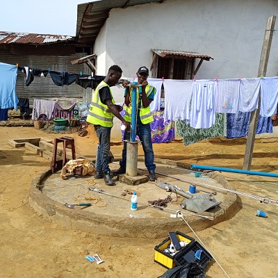 Hand-pump repair team at work