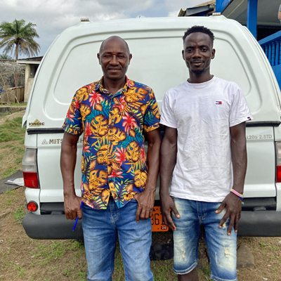 Pump Repair team in front of new vehicle