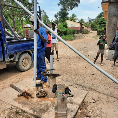 Team repairing handpumps
