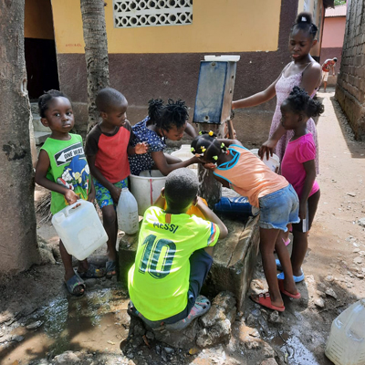 Children by newly repaired pump
