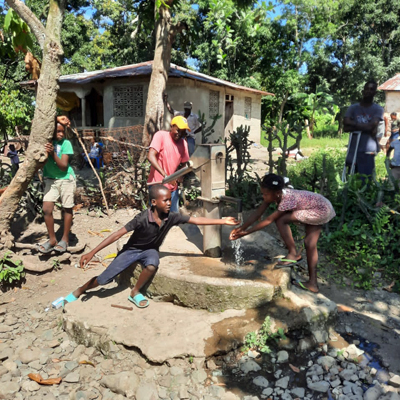 Children by newly repaired well