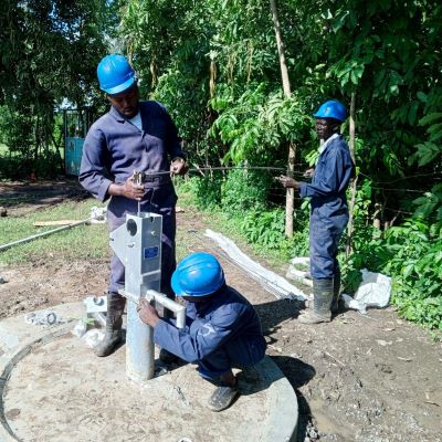 Hand pump installation in progress 