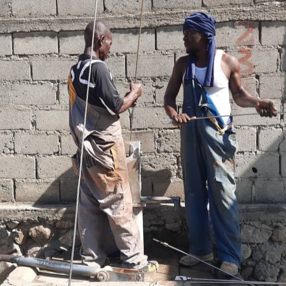 Fedan and Richard repairing Handpump