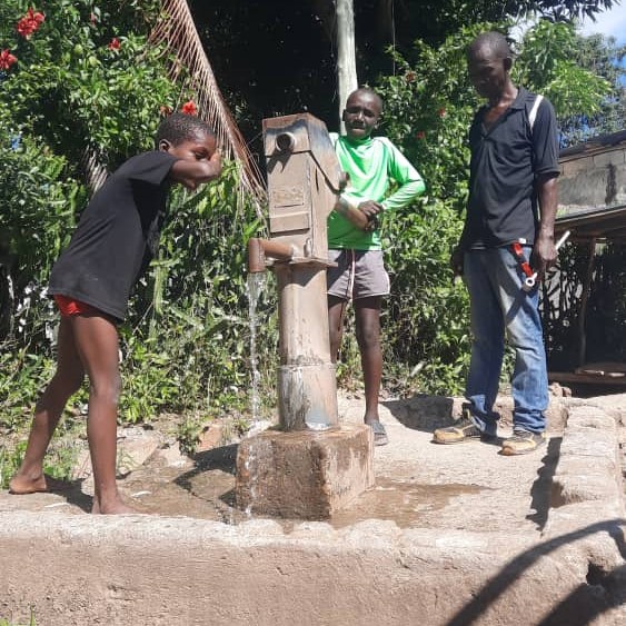 Child drinking rom repaired well