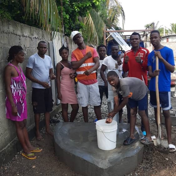 Villagers by Newly Rehabilitated Well