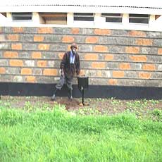 New Caretaker in front of Washroom