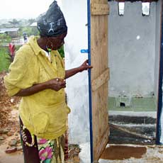 Village Woman by New Washroom